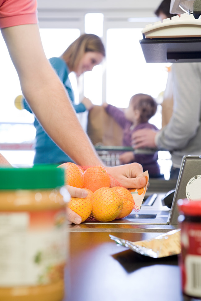 People at supermarket checkout