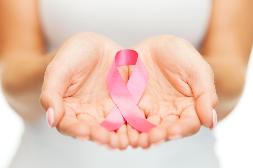 hands holding pink breast cancer awareness ribbon