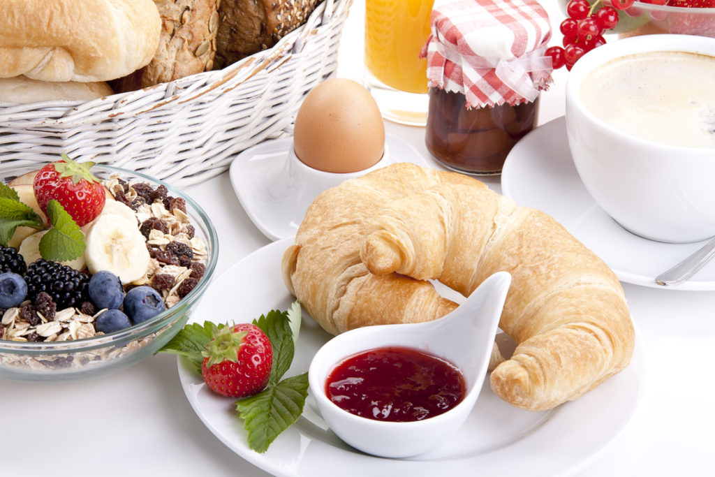 traditional french breakfast croissant isolated on white background