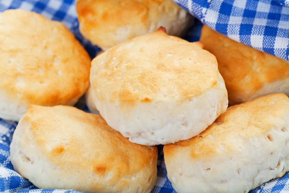 A rustic, country chic basket of freshly baked buttermilk biscuits. Shallow dof.